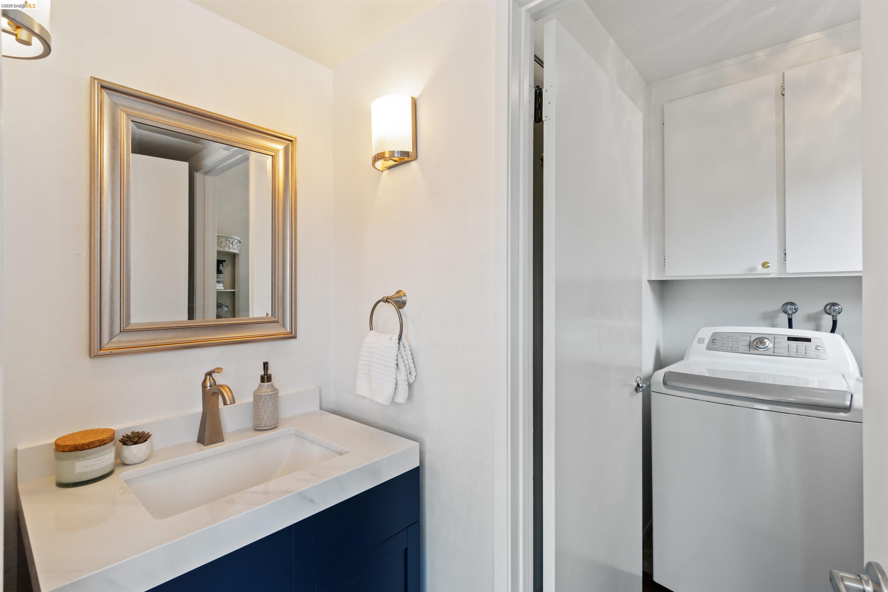 548 Queen's Road Alameda, CA 94501 - Photo 14 of 42 Bathroom featuring washer / clothes dryer and vanity