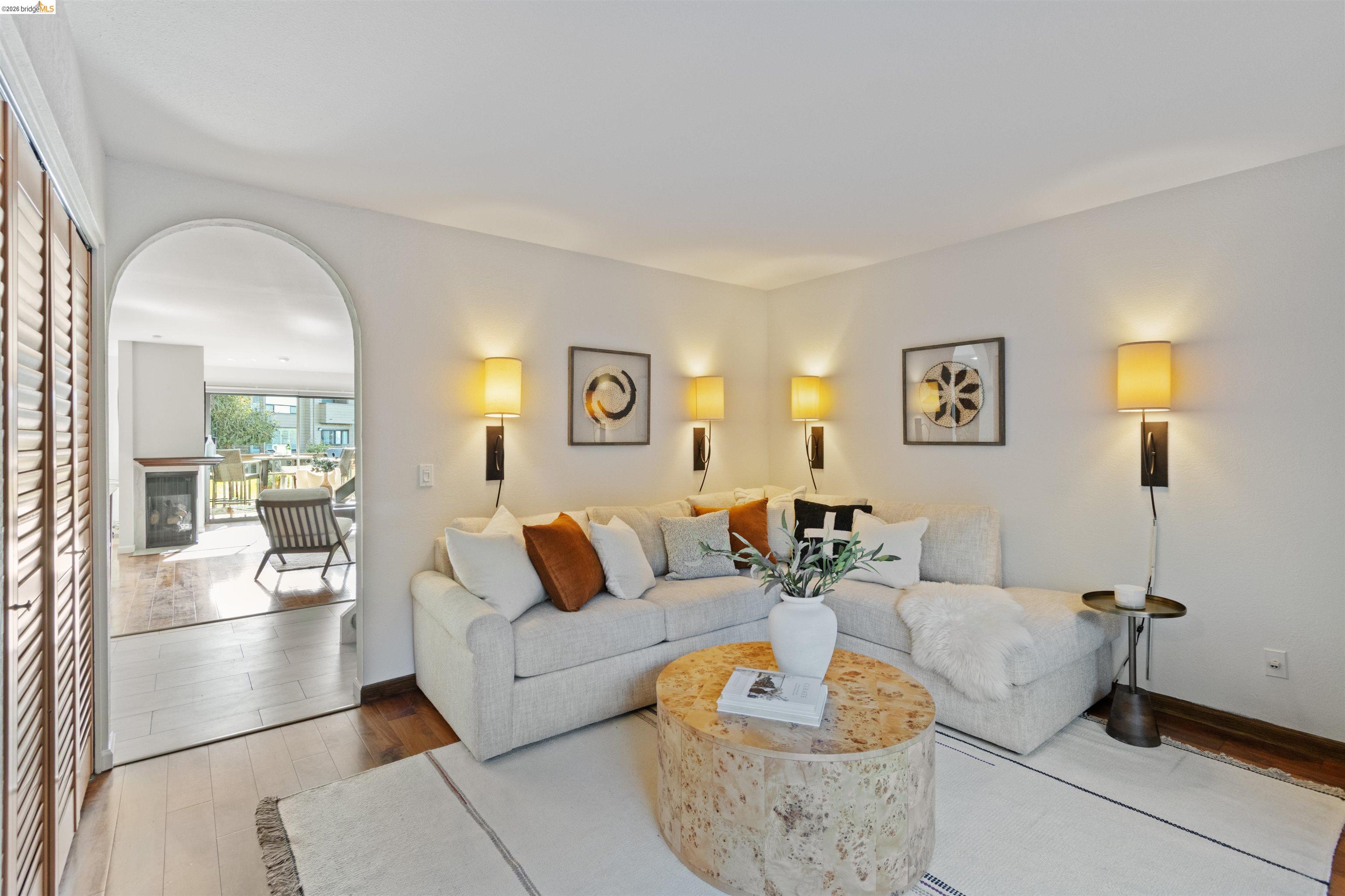 548 Queen's Road Alameda, CA 94501 - Photo 17 of 42 Living area featuring light wood-type flooring and a glass covered fireplace