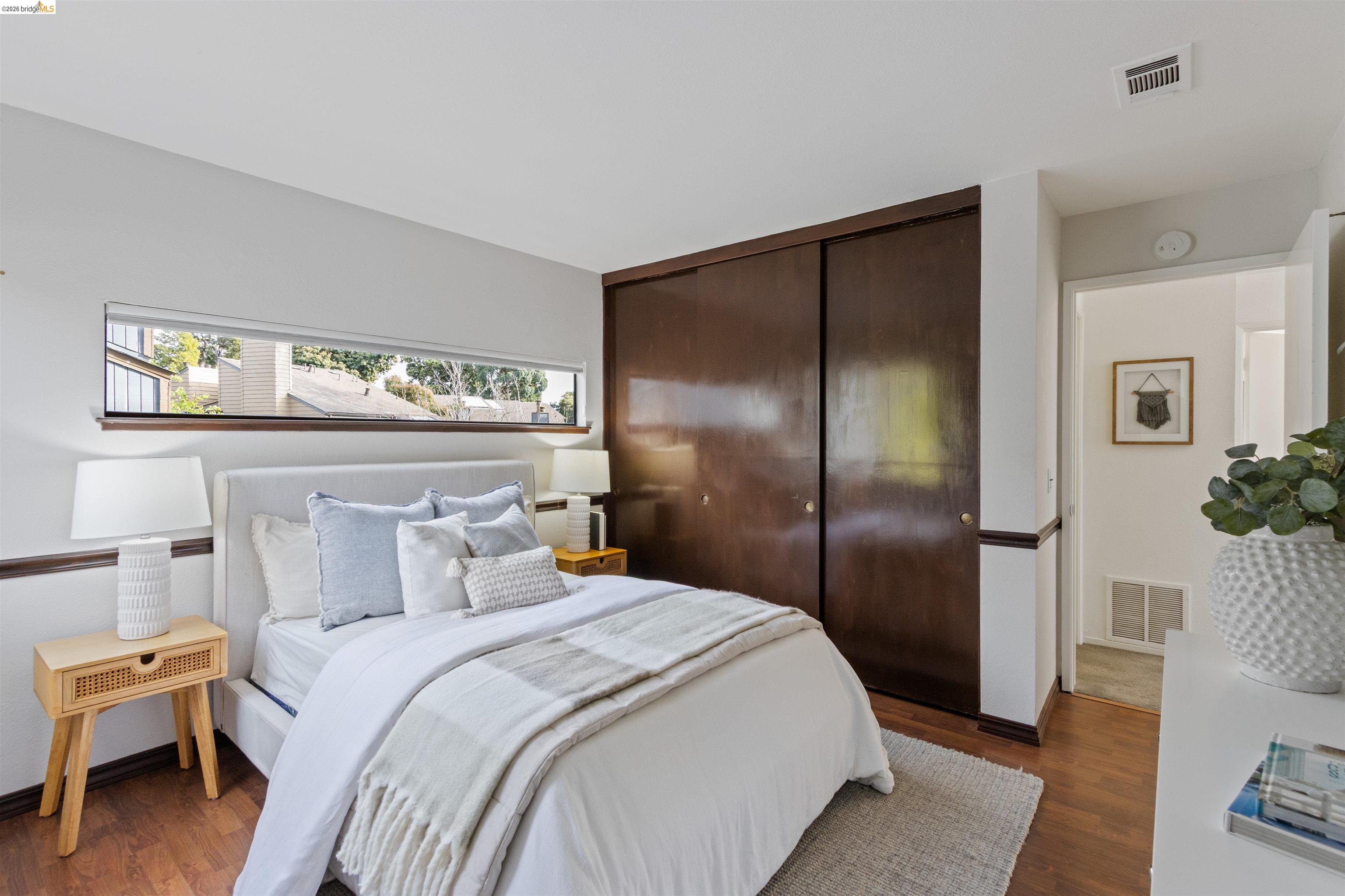 548 Queen's Road Alameda, CA 94501 - Photo 25 of 42 Bedroom featuring dark wood-type flooring and a closet