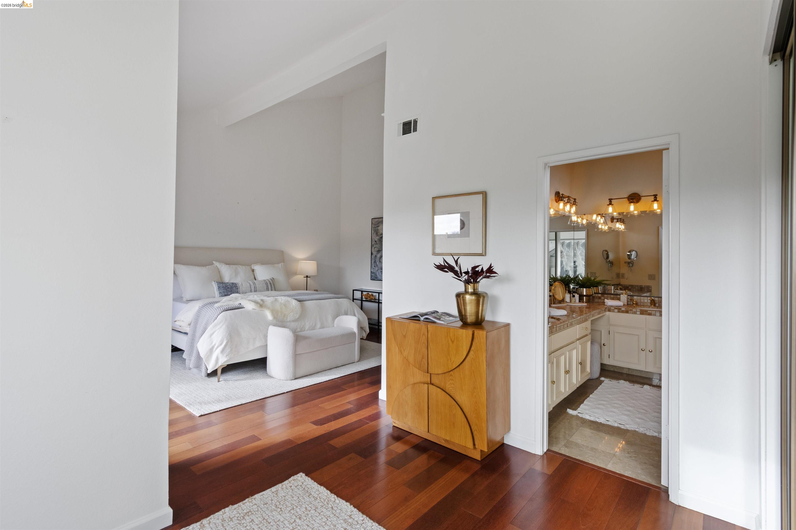 548 Queen's Road Alameda, CA 94501 - Photo 30 of 42 Bedroom with dark wood-style flooring, a high ceiling, and ensuite bath