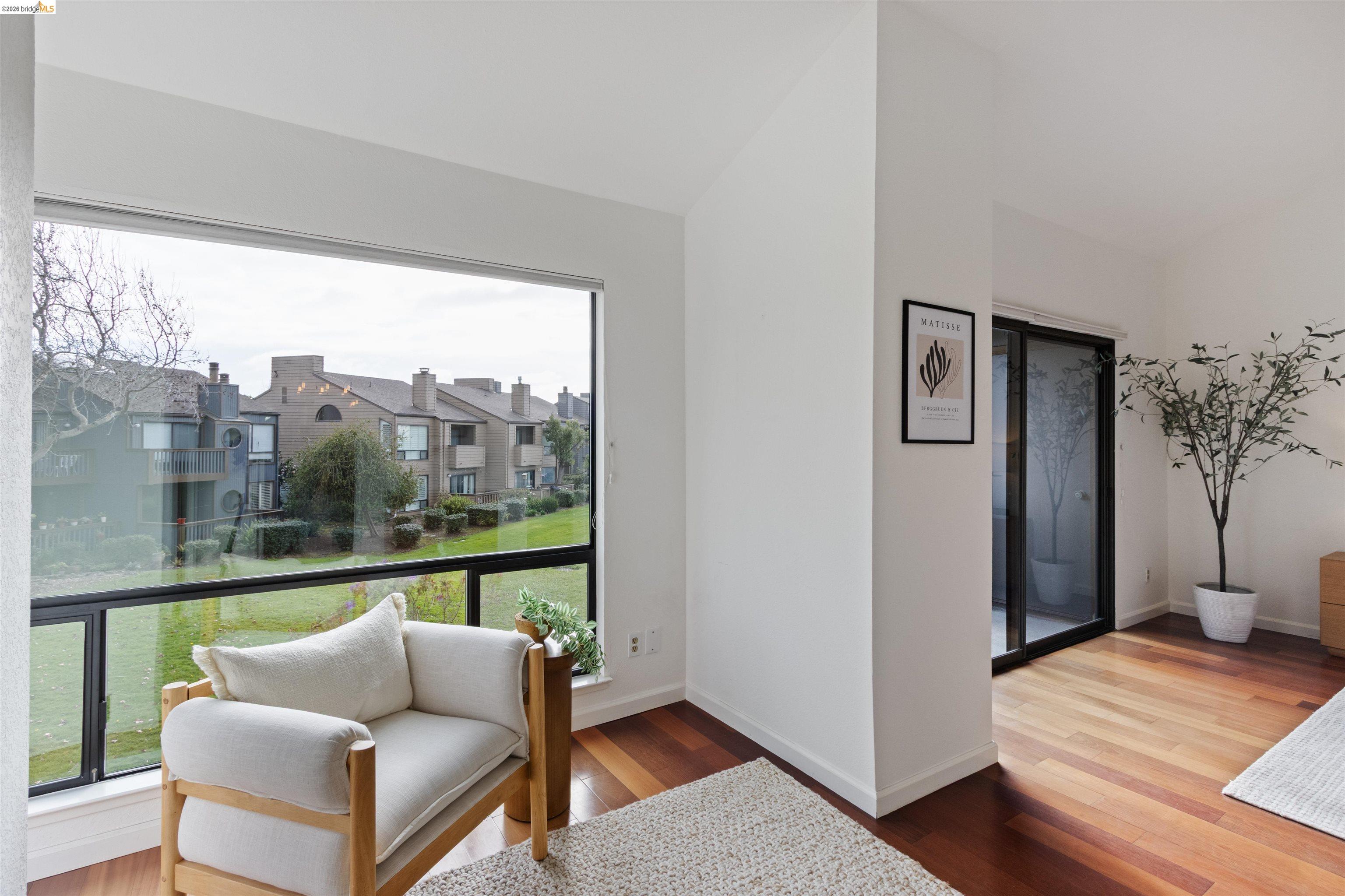 548 Queen's Road Alameda, CA 94501 - Photo 31 of 42 Sitting room featuring hardwood / wood-style floors, a residential view, and lofted ceiling