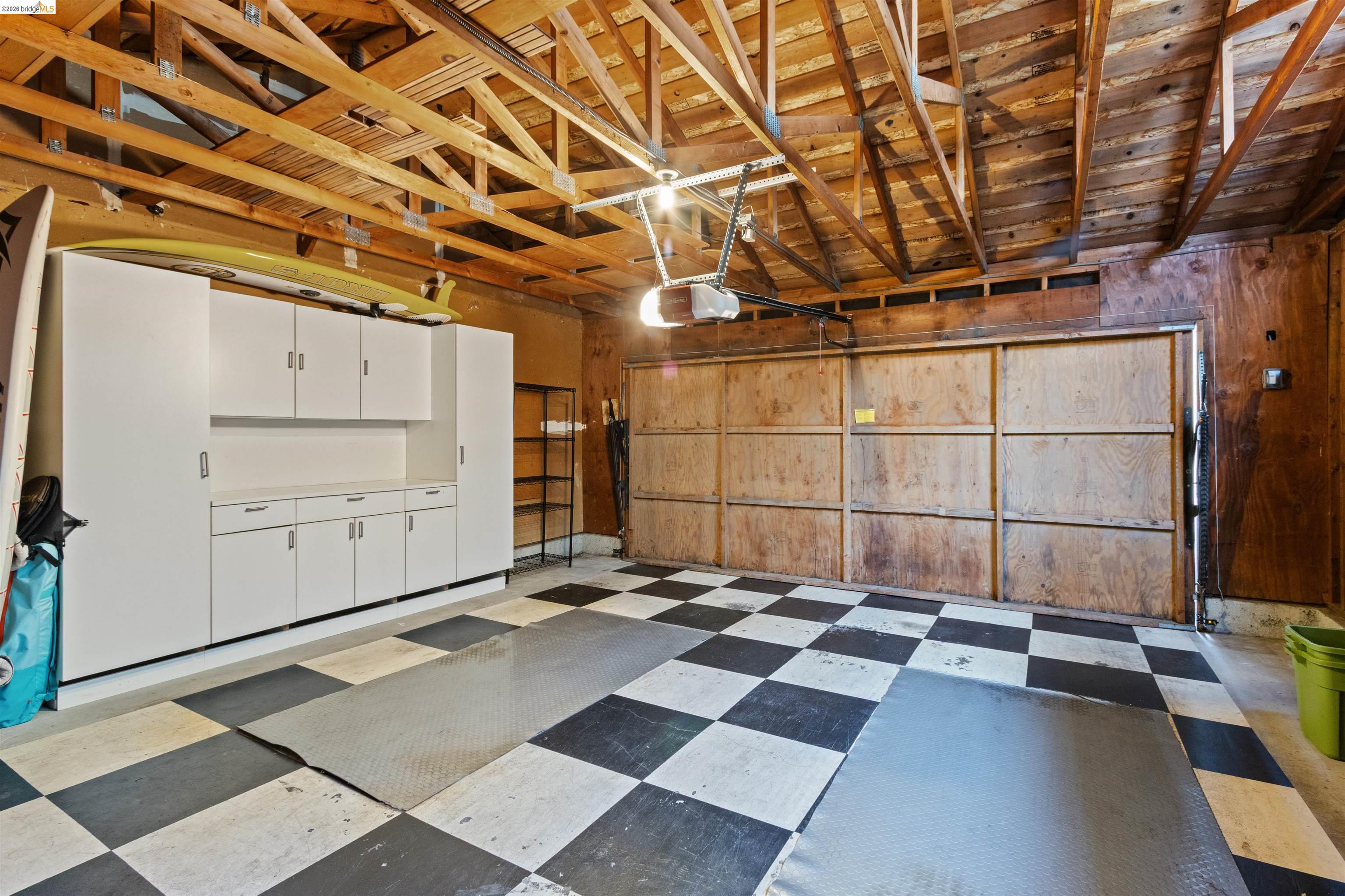 548 Queen's Road Alameda, CA 94501 - Photo 33 of 42 Garage featuring a garage door opener