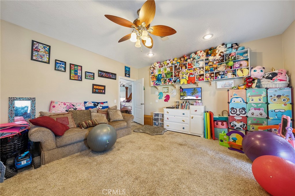 7172 Jargon Road Hesperia, CA 92344 - Photo 43 of 75 a bed room with furniture and a baby crib
