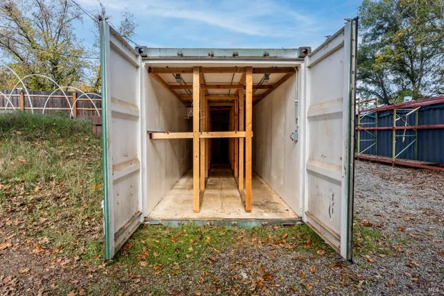 a backyard of a house with a tree