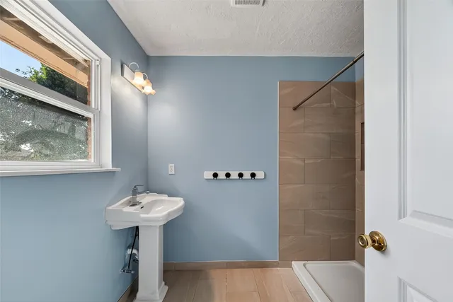 a bathroom with a sink toilet