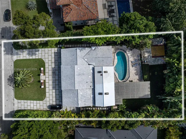 an aerial view of a house with a garden