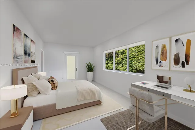 a bedroom with a bed and a table in it