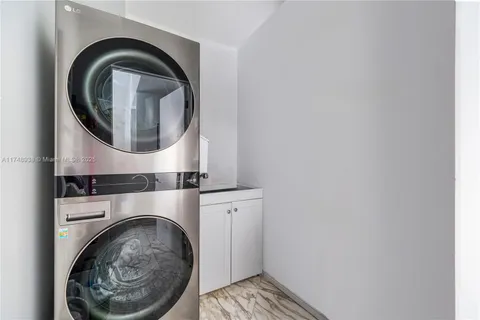 a close view of a utility room with dryer and washer