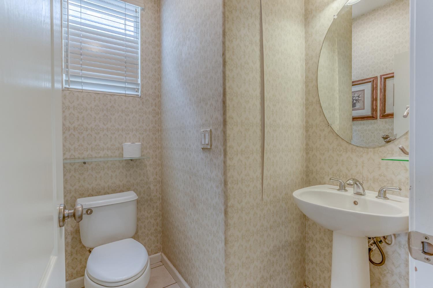 188 Thomsen Road Lathrop, CA 95330 - Photo 7 of 27 a bathroom with a sink a toilet and mirror