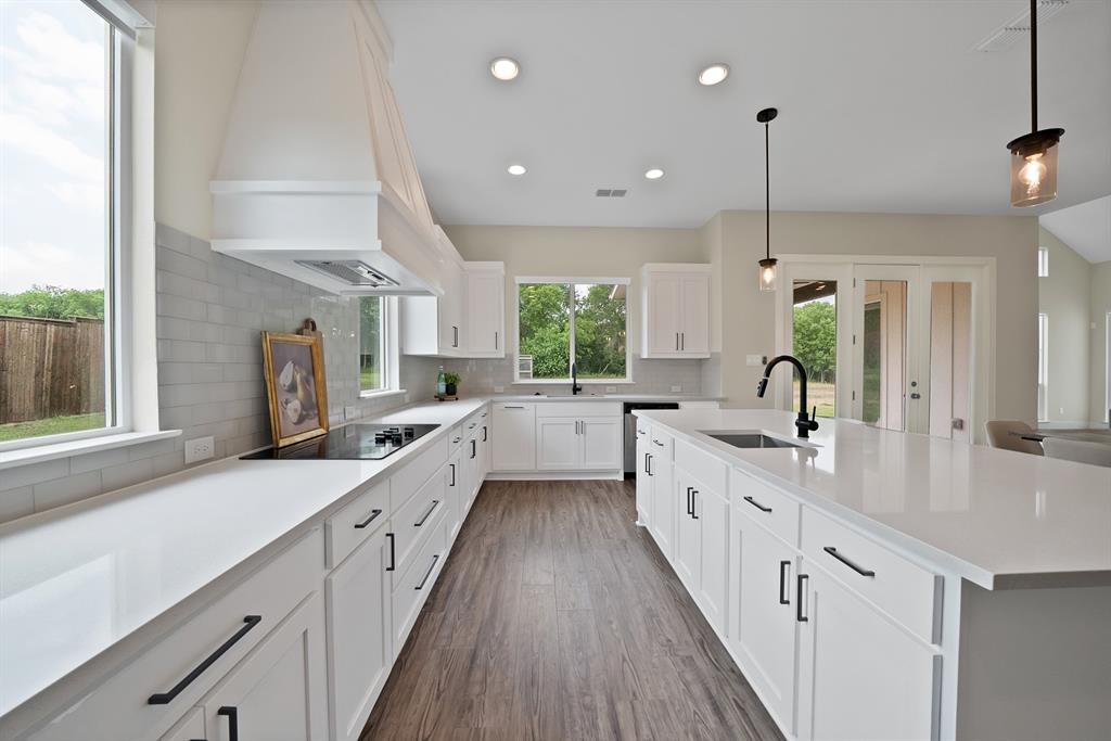 2223 Providence Way Nevada, TX 75173 - Photo 22 of 40 a large kitchen with a lot of counter space and a sink