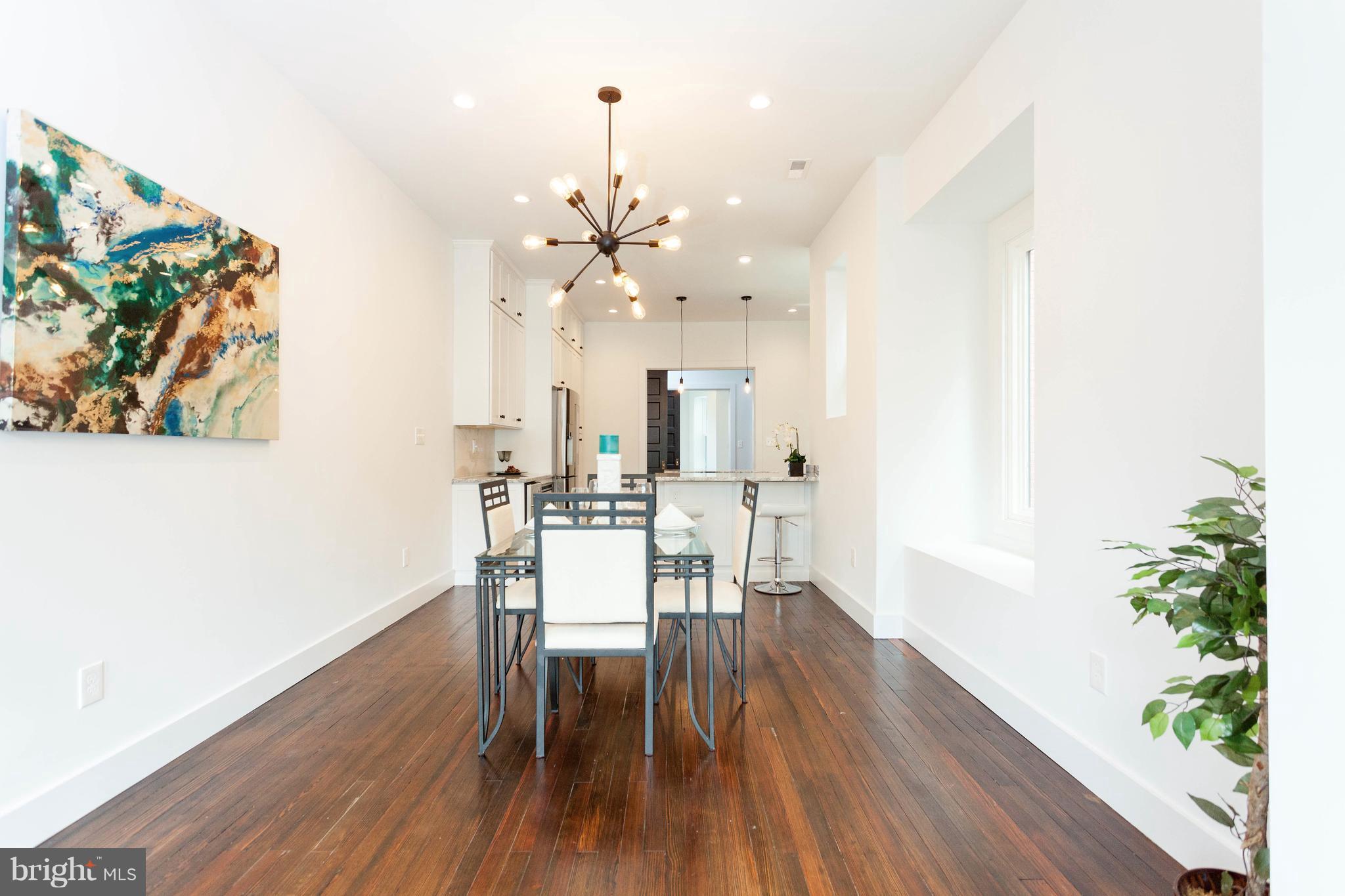 15 R Street Northeast, Unit A Washington, DC 20002 - Photo 11 of 25 a view of a dining room with furniture and wooden floor