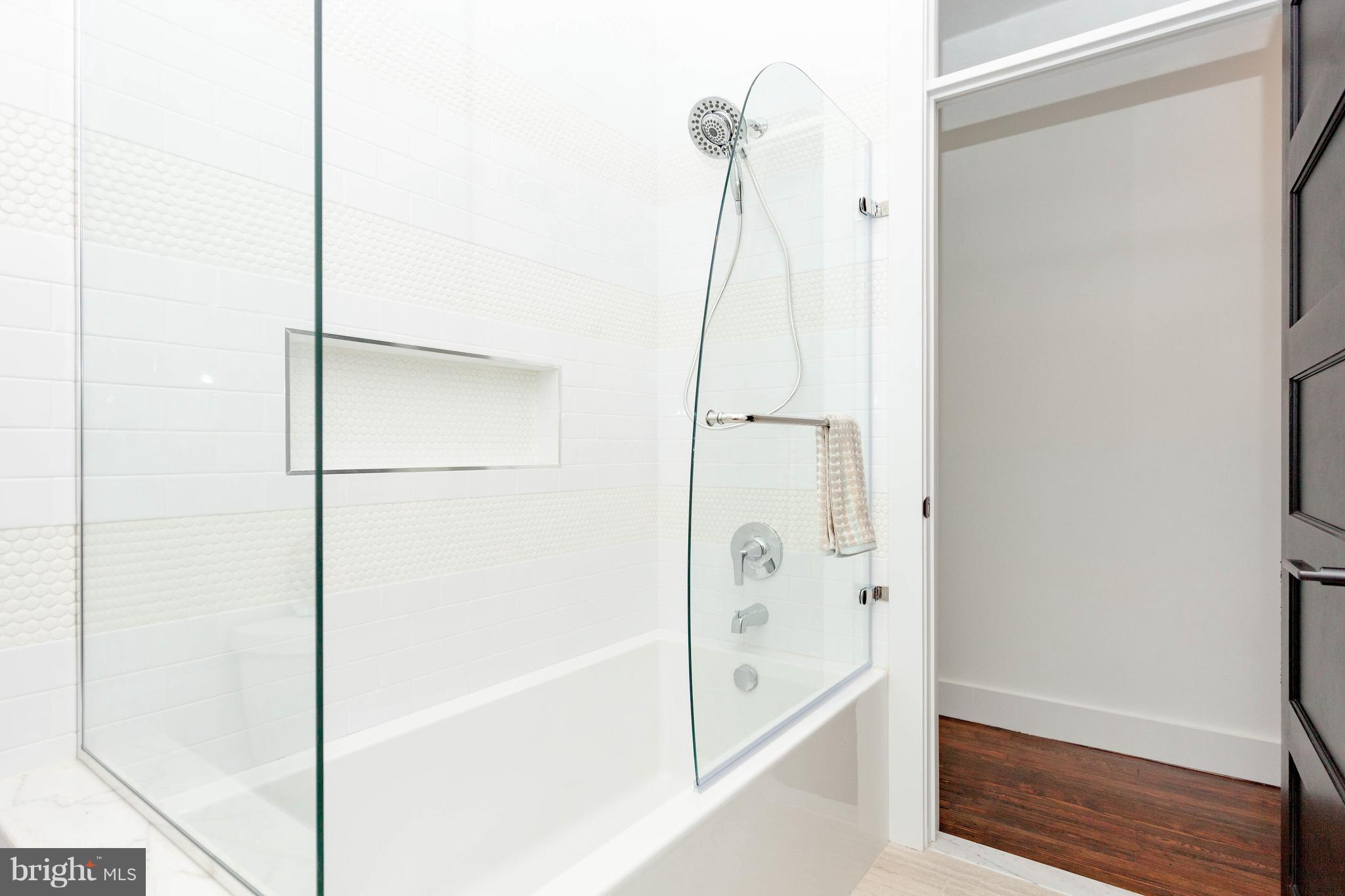 15 R Street Northeast, Unit A Washington, DC 20002 - Photo 17 of 25 a bathroom with a bathtub and a shower