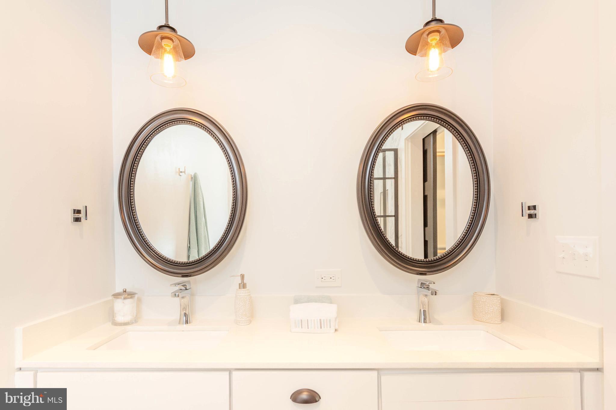 15 R Street Northeast, Unit A Washington, DC 20002 - Photo 22 of 25 a bathroom with a sink and a mirror
