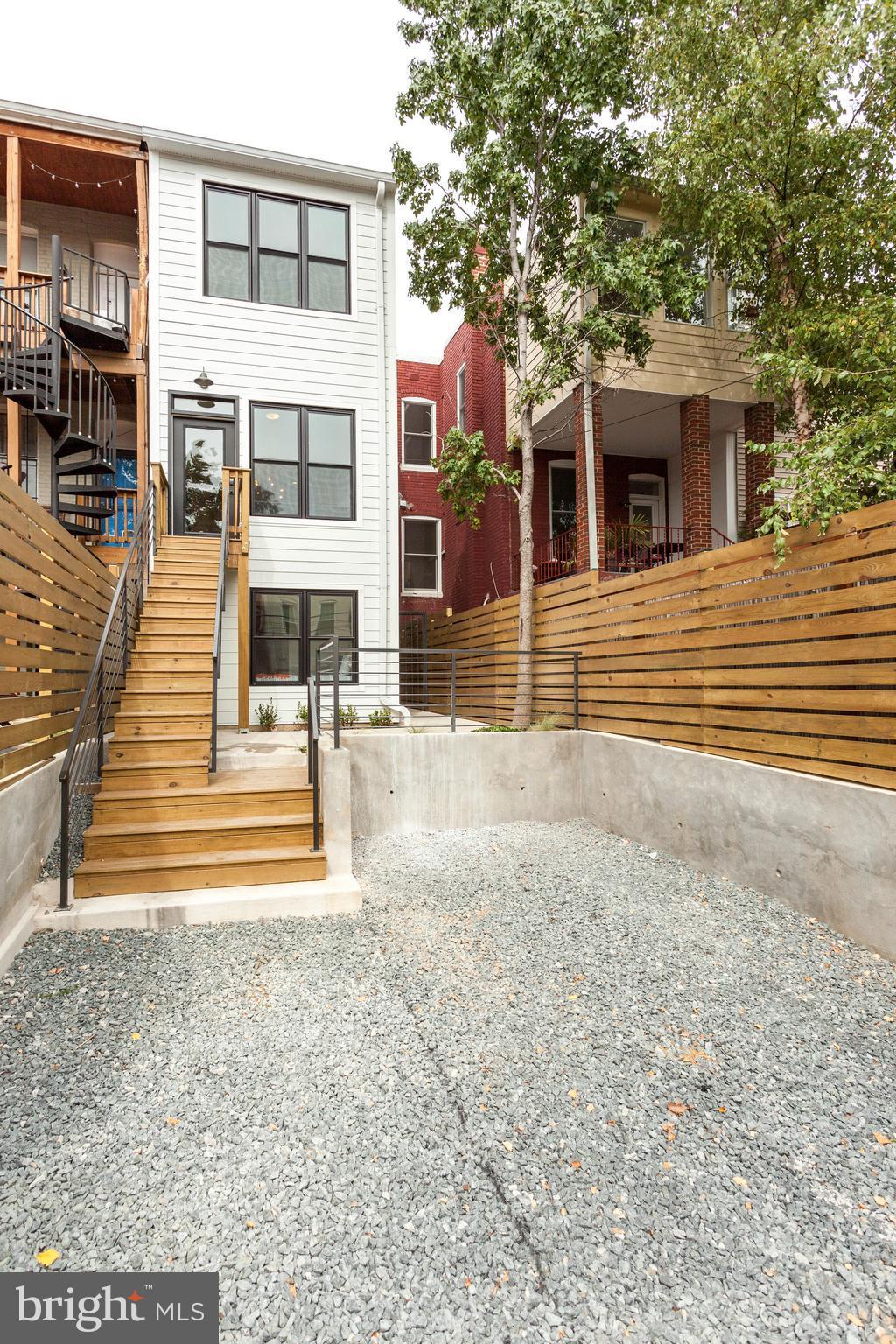 15 R Street Northeast, Unit A Washington, DC 20002 - Photo 24 of 25 a view of a house with backyard and sitting area
