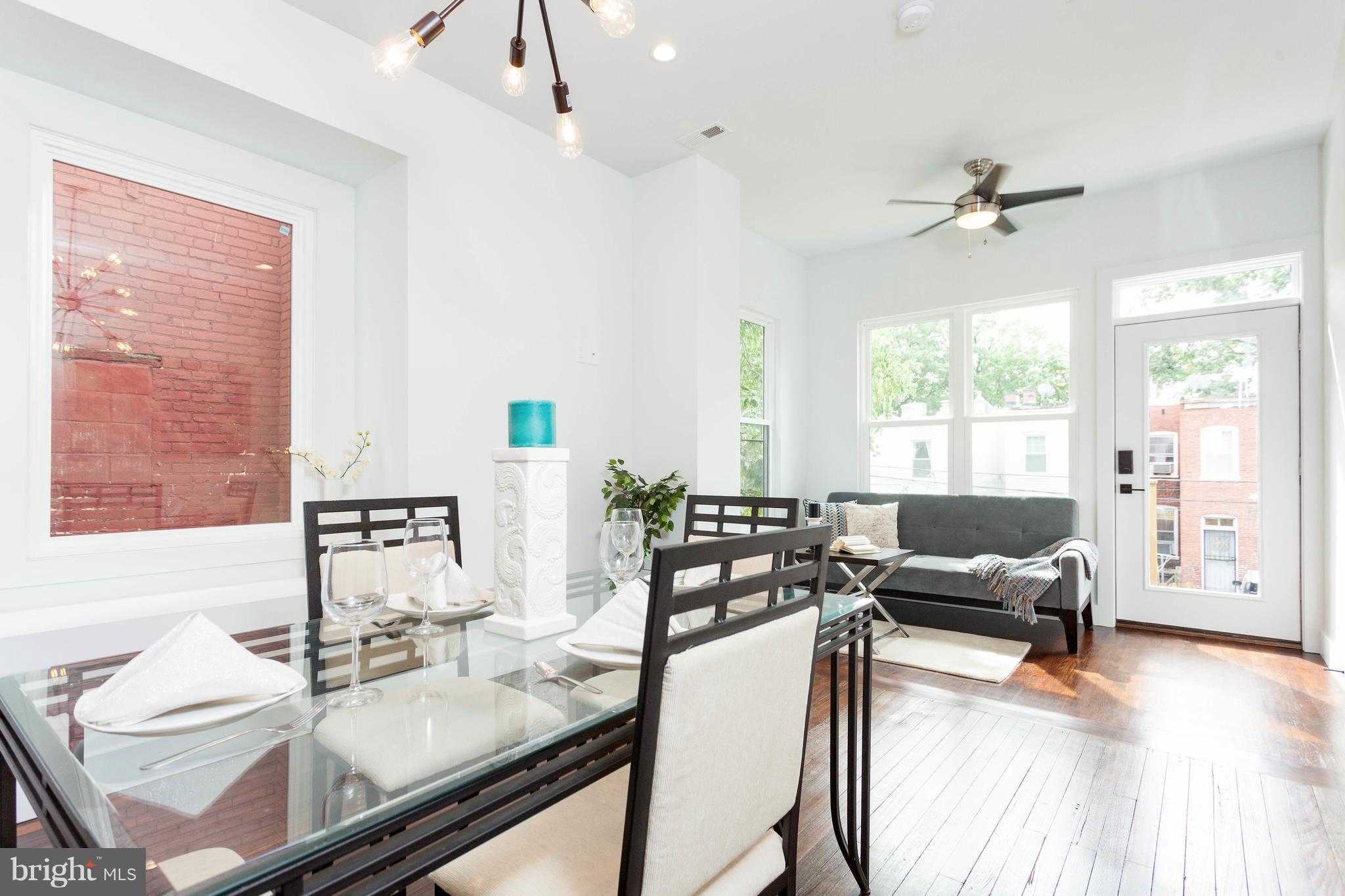 15 R Street Northeast, Unit A Washington, DC 20002 - Photo 10 of 25 a living room with furniture and a large window