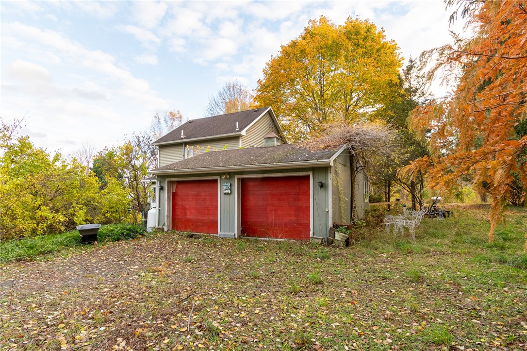 3335 Gildersleeve Road Marion, NY 14505 - Photo 4 of 11 The ATTACHED TWO CAR GARAGE with a workshop!