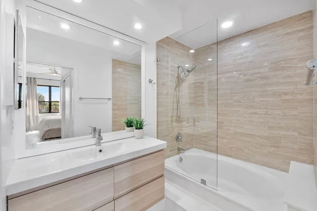 a bathroom with a bathtub and a sink