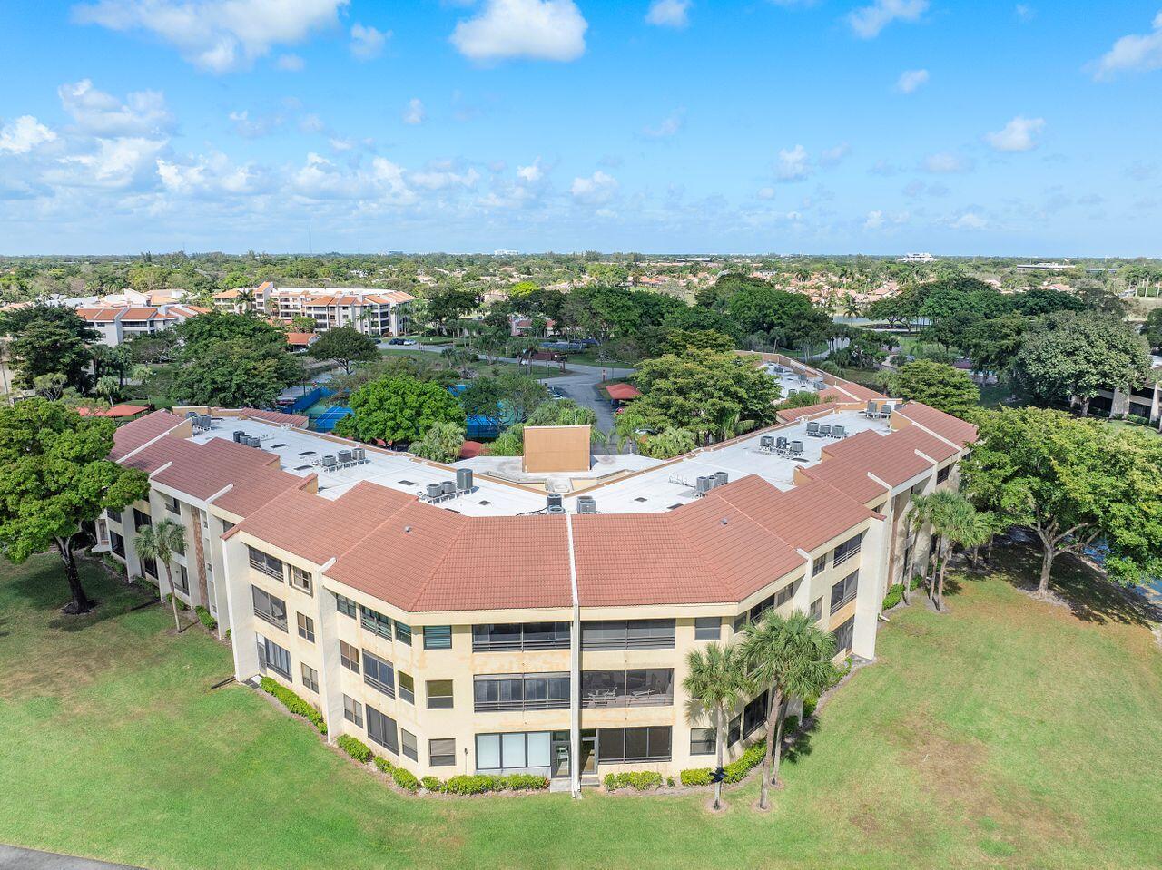 7508 La Paz Boulevard, Unit 304 Boca Raton, FL 33433 - Photo 29 of 44 an outdoor space with pool and ocean view