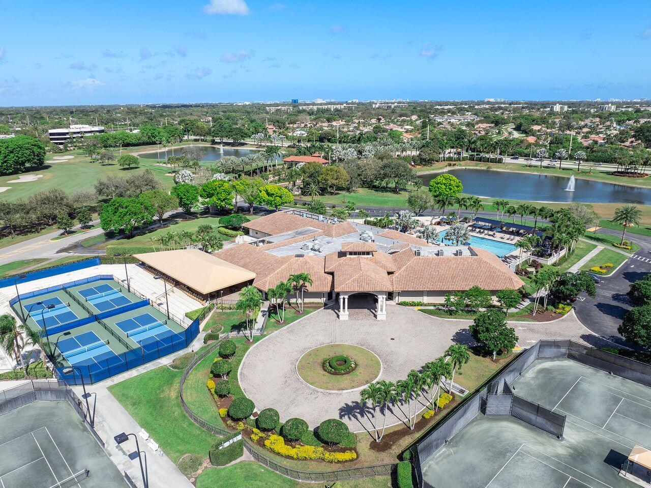 7508 La Paz Boulevard, Unit 304 Boca Raton, FL 33433 - Photo 33 of 44 an aerial view of a house with outdoor space