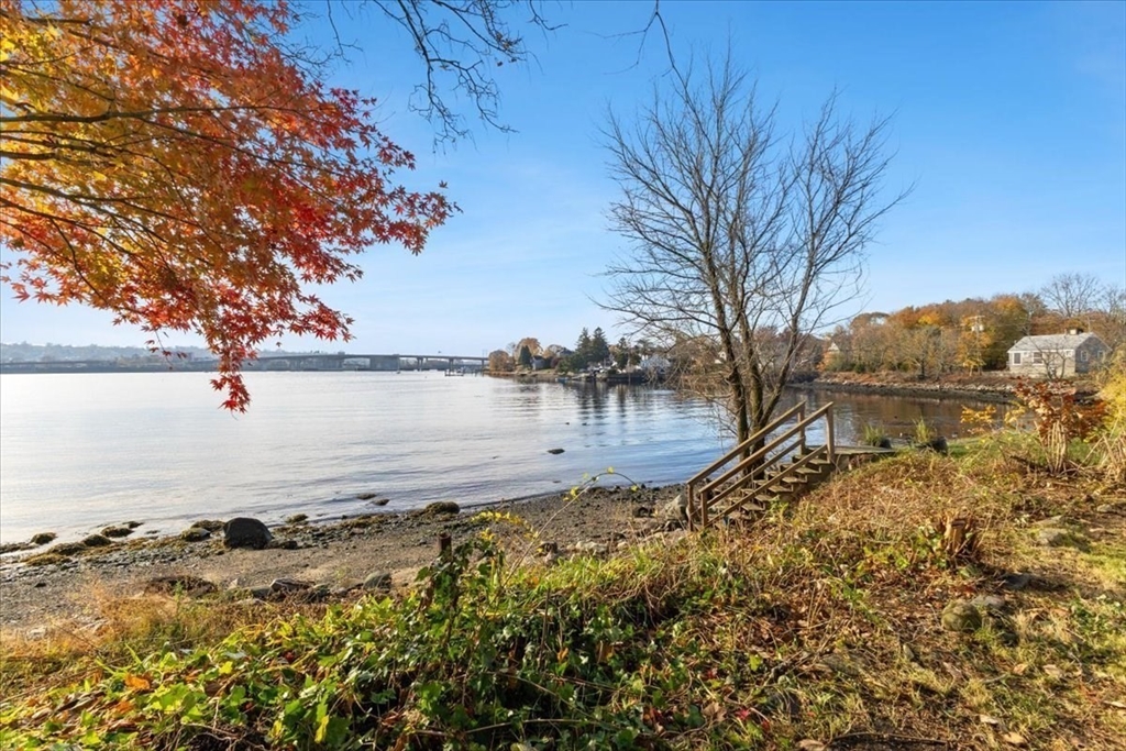 1496 Riverside Avenue Somerset, MA 02726 - Photo 11 of 40 a large body of water with a tree in the background