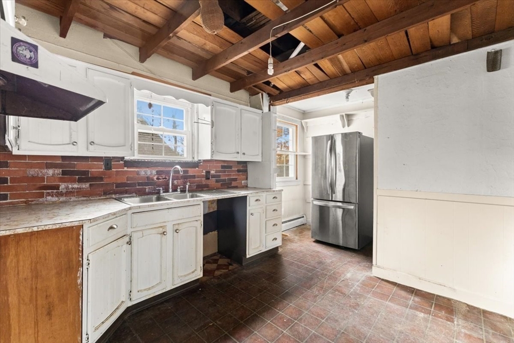 1496 Riverside Avenue Somerset, MA 02726 - Photo 19 of 40 a kitchen with refrigerator and window