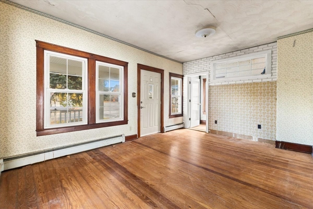 1496 Riverside Avenue Somerset, MA 02726 - Photo 20 of 40 a view of an empty room with wooden floor and a window