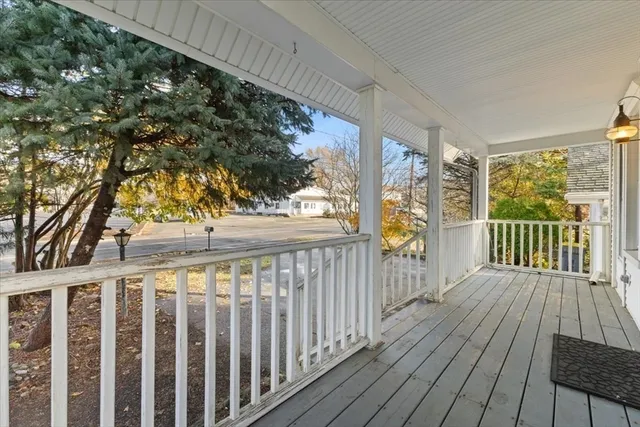 a view of a balcony with wooden floor