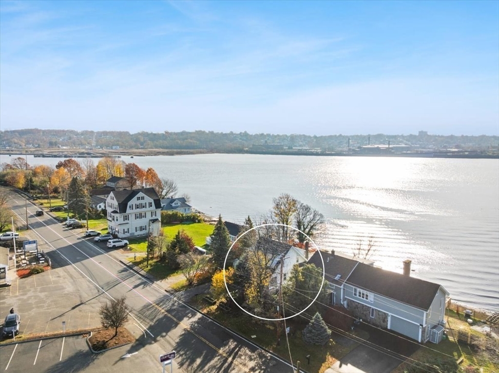 1496 Riverside Avenue Somerset, MA 02726 - Photo 5 of 40 an ocean beach with lots of residential buildings and ocean view