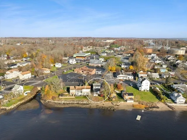 an aerial view of residential houses with city view