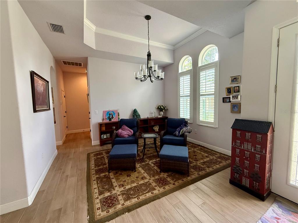 13110 Bamboo Street Spring Hill, FL 34609 - Photo 38 of 56 a view of a dining room with furniture window and wooden floor