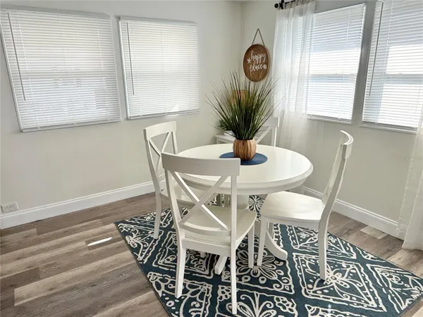a dining room with furniture and window
