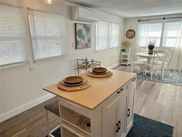 a view of a kitchen area with furniture and window