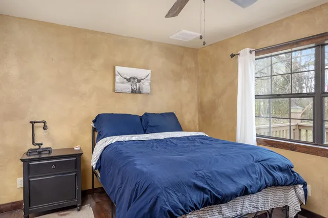 a bathroom with a granite countertop sink and mirror