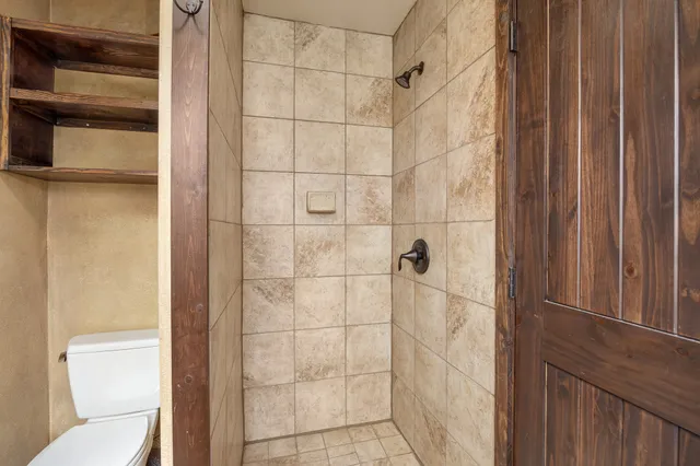 a kitchen with a stove a refrigerator and a sink