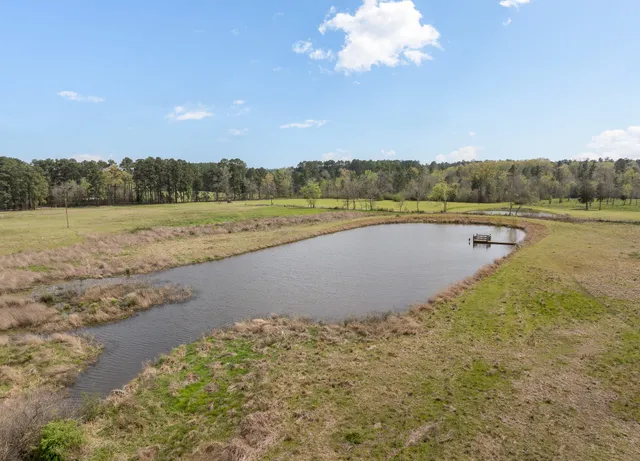 a view of a lake with a yard