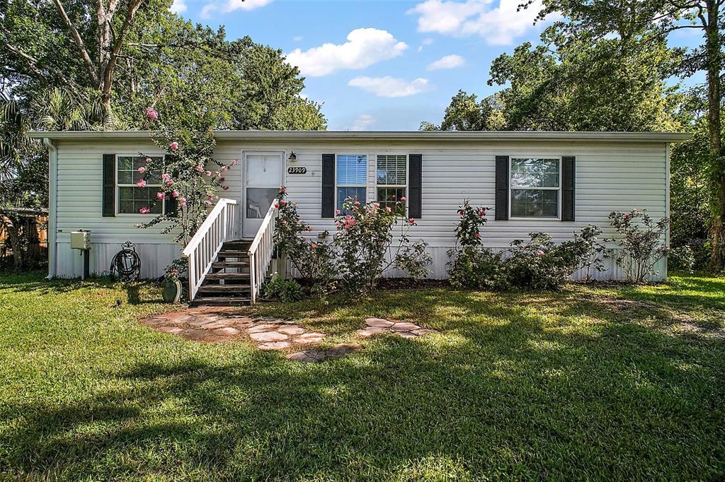 23909 Deer Road Astor, FL 32102 - Photo 1 of 1 a view of a house with backyard