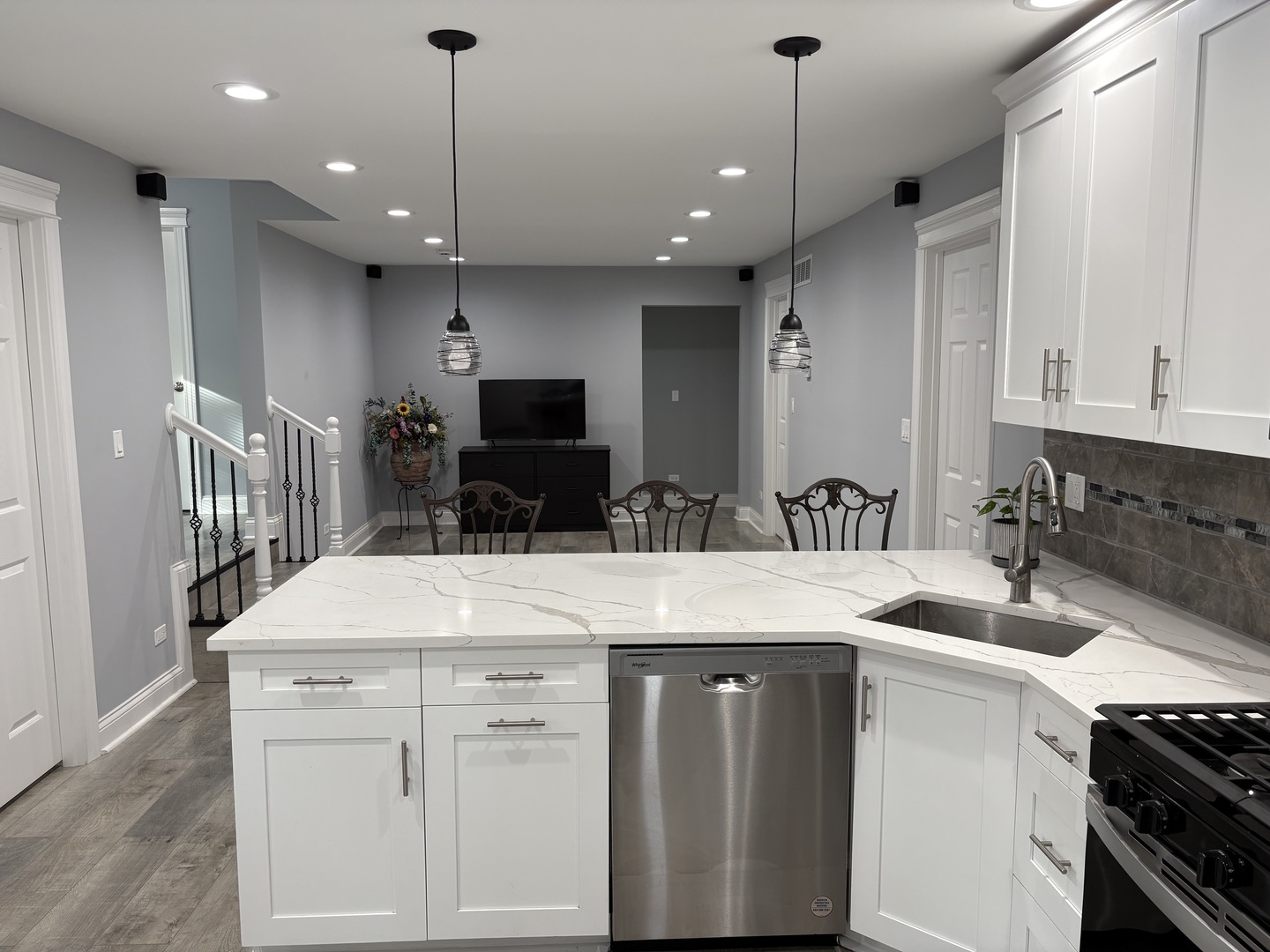 5517 Essex Road Lisle, IL 60532 - Photo 2 of 19 a kitchen with kitchen island a sink stainless steel appliances and cabinets
