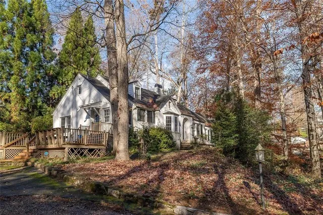 a view of house with a yard