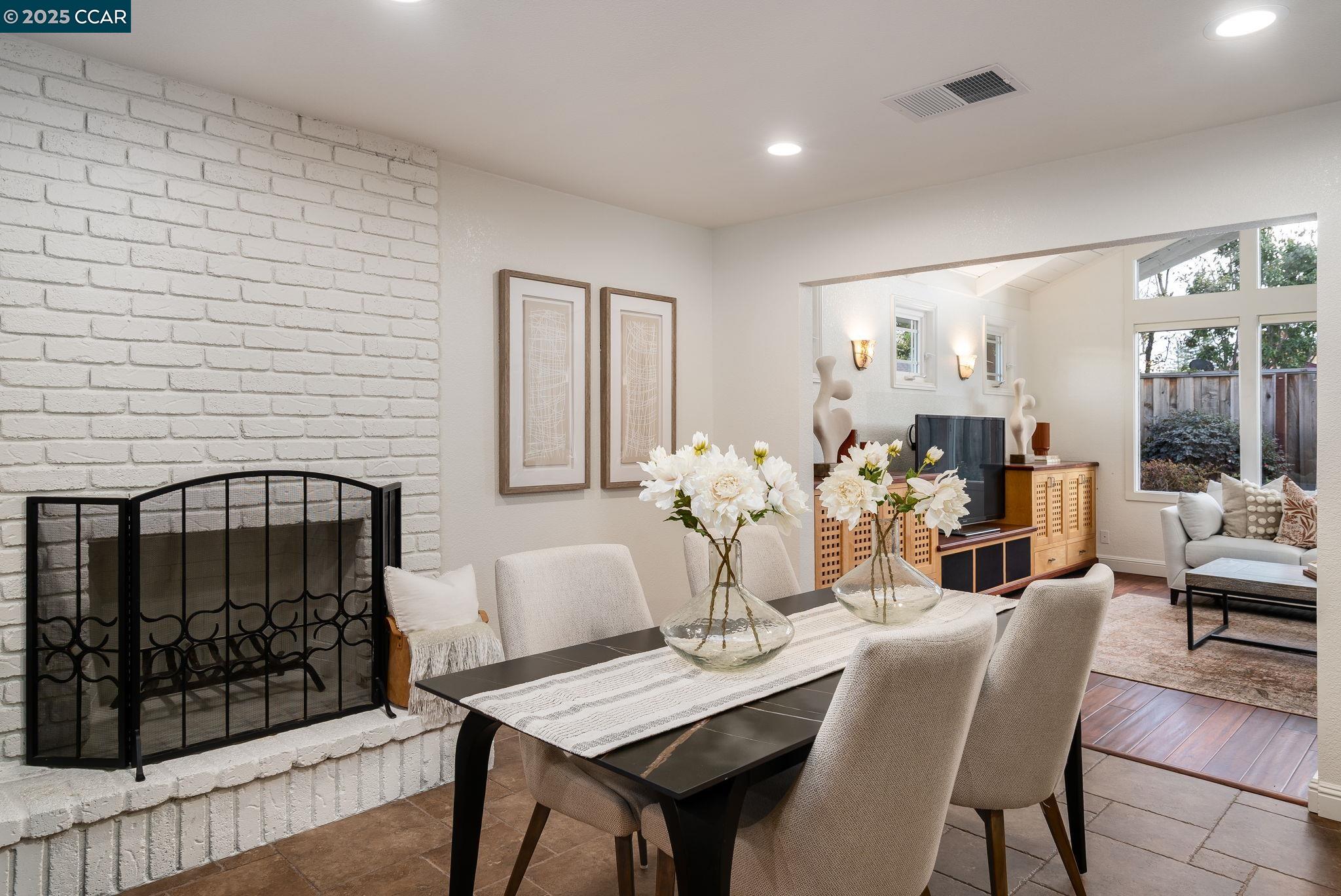 2828 Aptos Way San Ramon, CA 94583 - Photo 12 of 38 a living room with furniture a fireplace and a table
