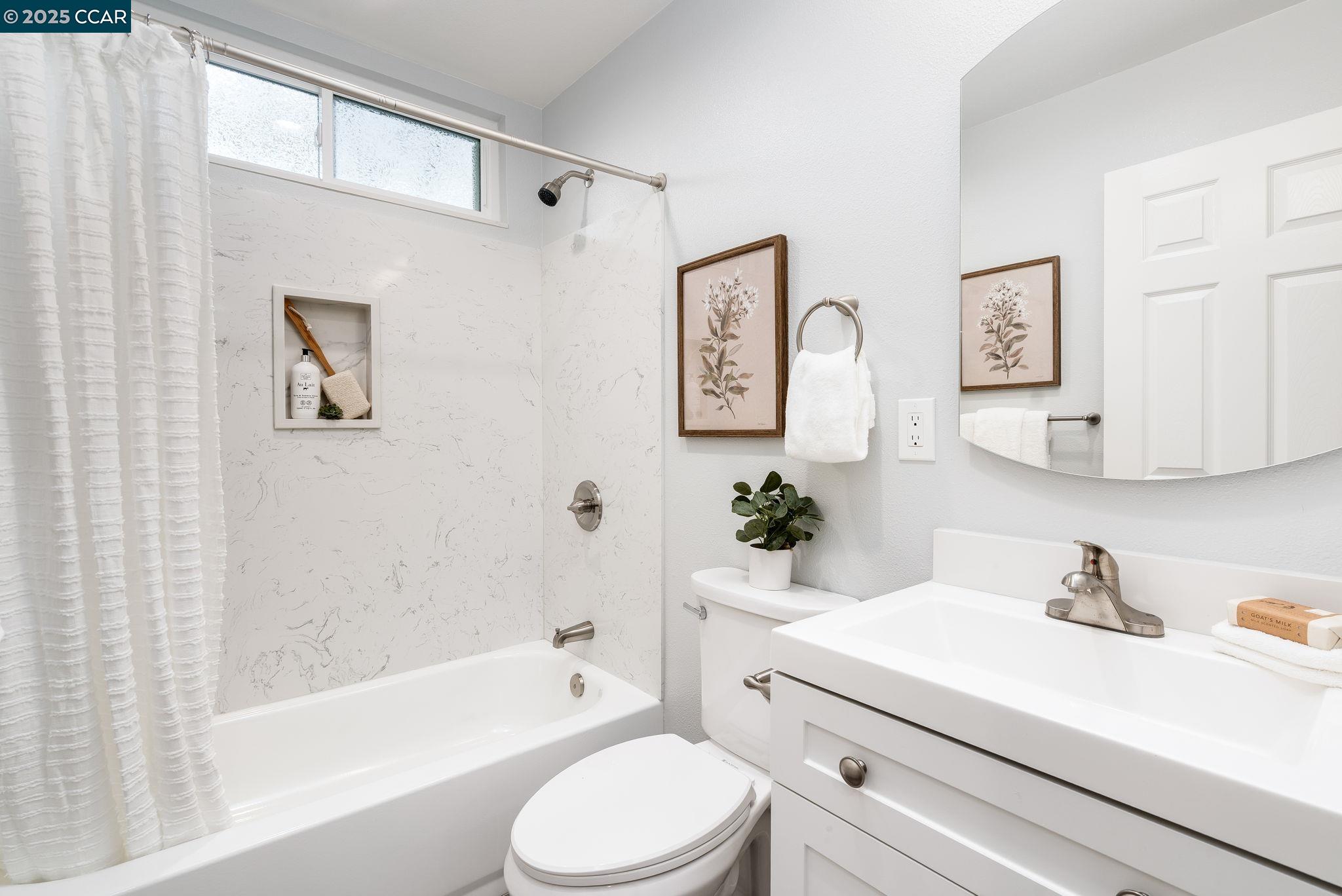 2828 Aptos Way San Ramon, CA 94583 - Photo 19 of 38 a bathroom with a sink a toilet and a bathtub