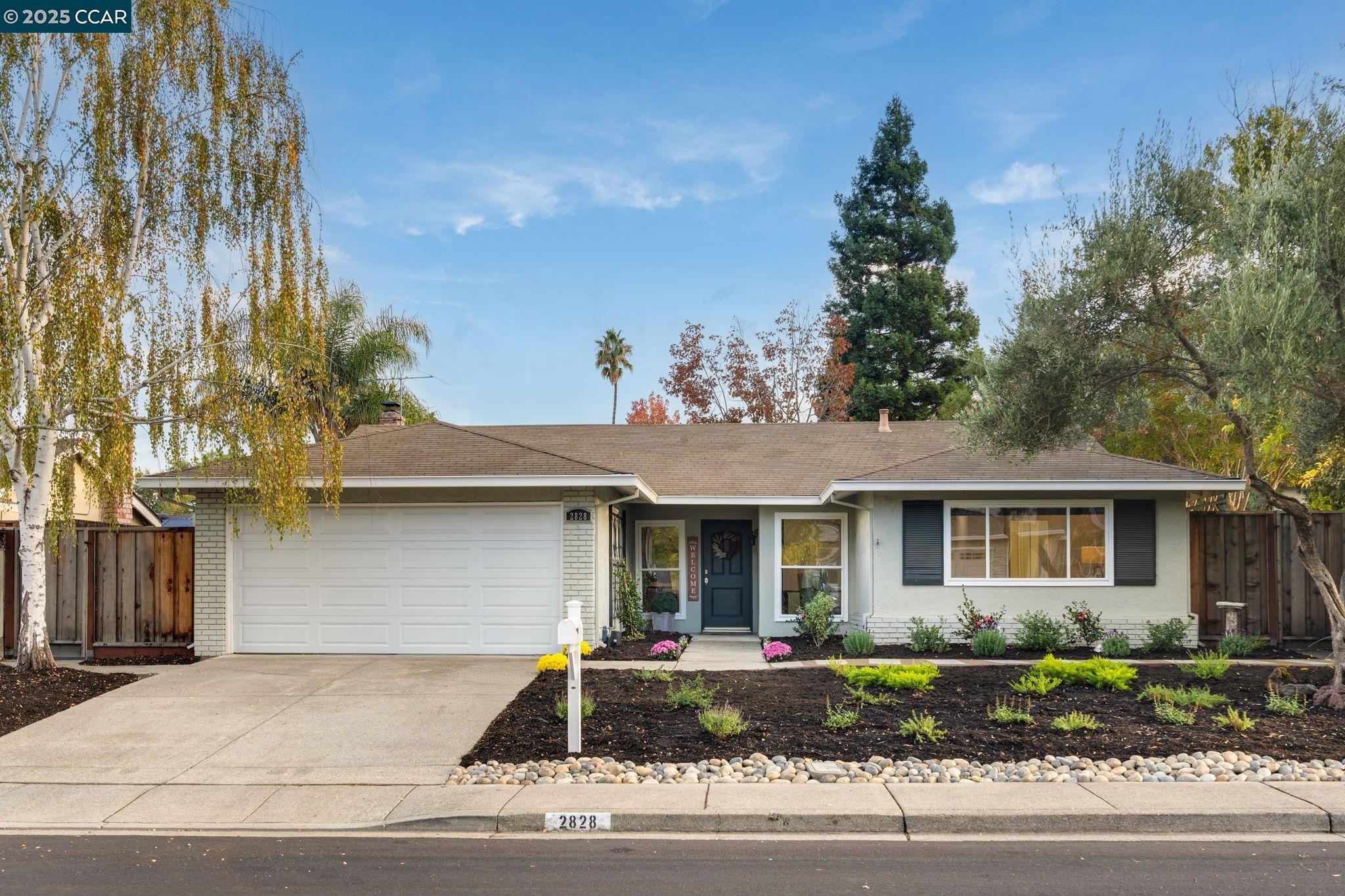 2828 Aptos Way San Ramon, CA 94583 - Photo 2 of 38 a front view of a house with a yard and garage