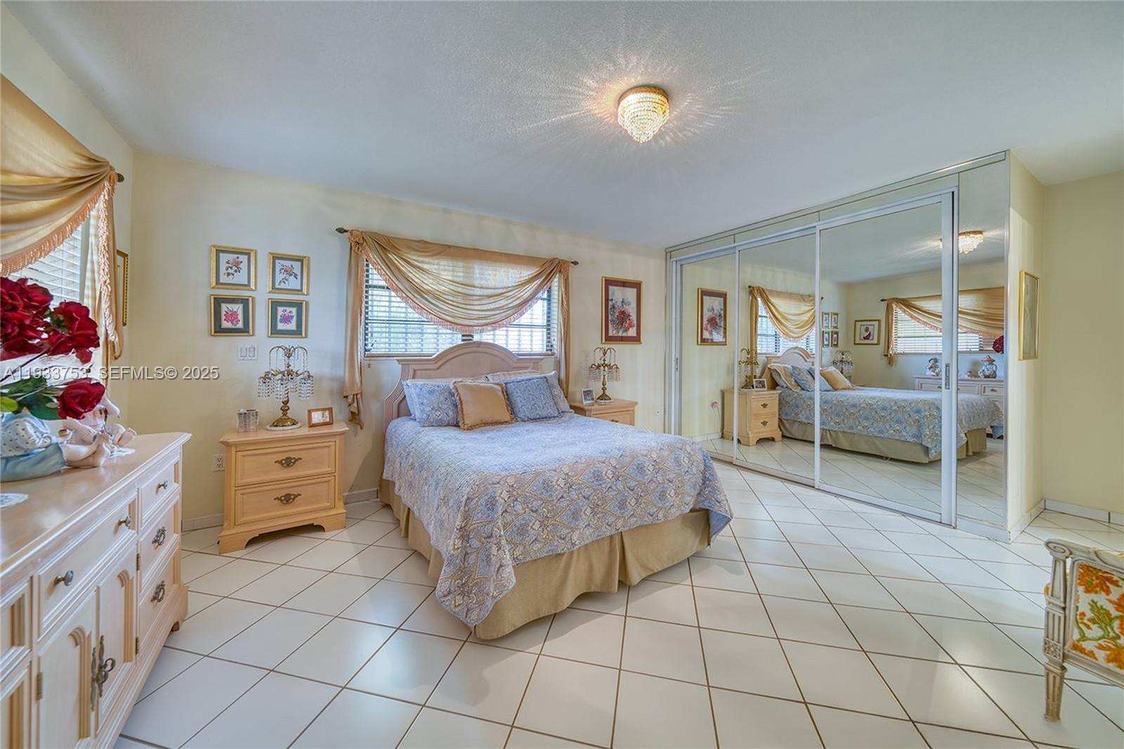 3585 Southwest 107th Court Miami, FL 33165 - Photo 23 of 45 a spacious bedroom with a bed and a cabinets