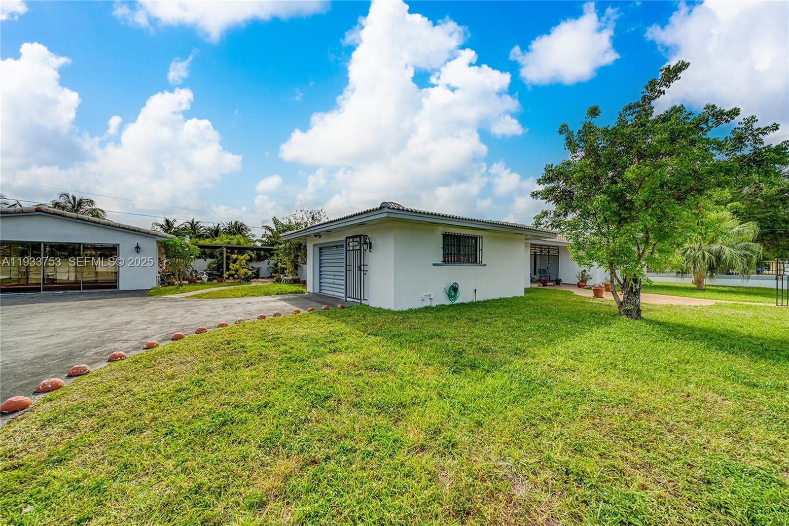 3585 Southwest 107th Court Miami, FL 33165 - Photo 5 of 45 a view of a house with backyard and garden