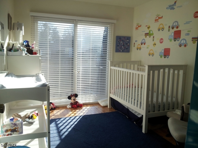 1 Carriage Way, Unit 8 Montclair, NJ 07042 - Photo 16 of 26 a bedroom with a bed and a window
