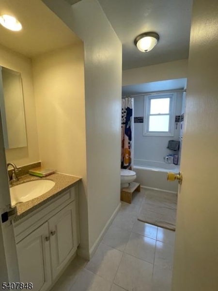 1 Carriage Way, Unit 8 Montclair, NJ 07042 - Photo 17 of 26 a bathroom with a sink and a mirror