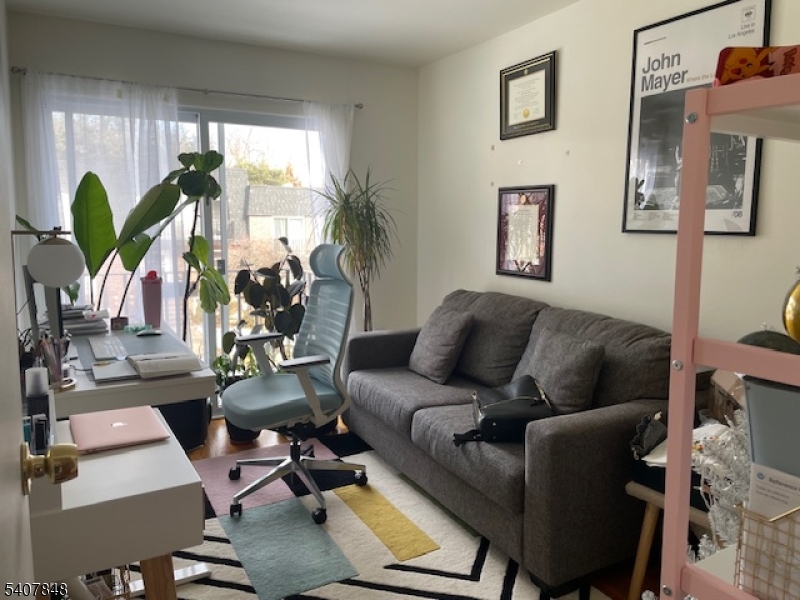 1 Carriage Way, Unit 8 Montclair, NJ 07042 - Photo 21 of 26 a living room with furniture a plant and a window