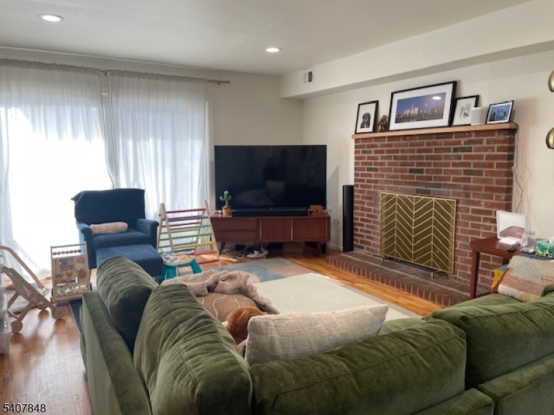 1 Carriage Way, Unit 8 Montclair, NJ 07042 - Photo 5 of 26 a living room with furniture and a flat screen tv