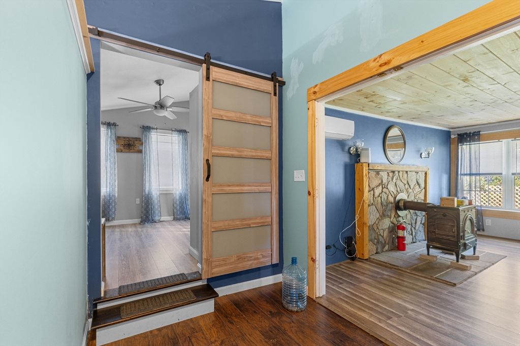 15 Morrison Way Lakeville, MA 02347 - Photo 17 of 26 a view of a livingroom with wooden floor and a ceiling fan