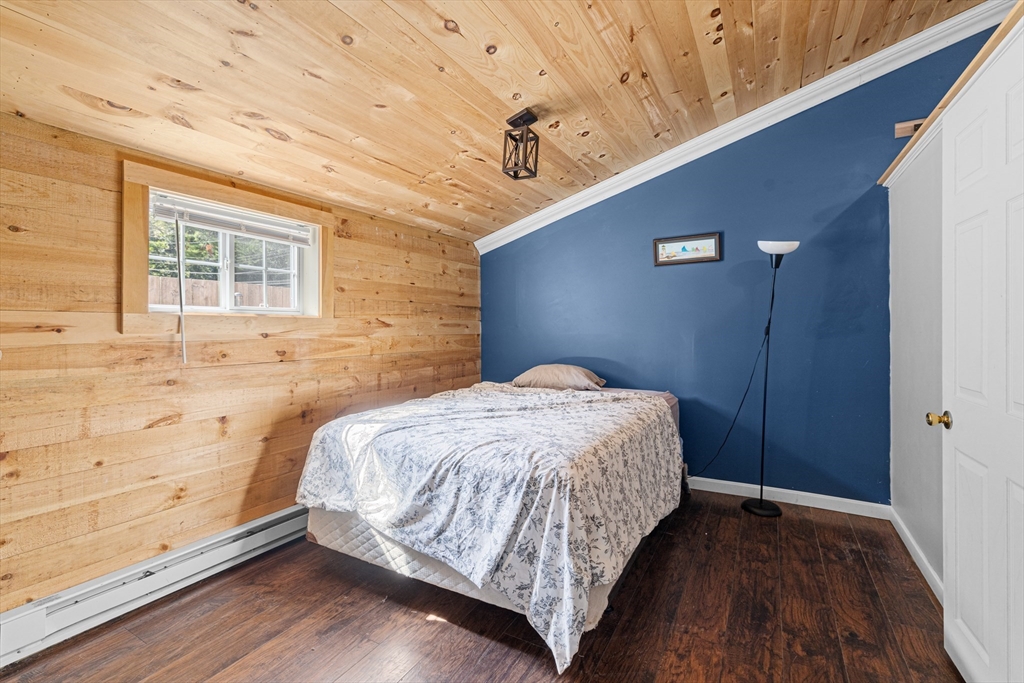 15 Morrison Way Lakeville, MA 02347 - Photo 19 of 26 a bedroom with a bed and wooden floor