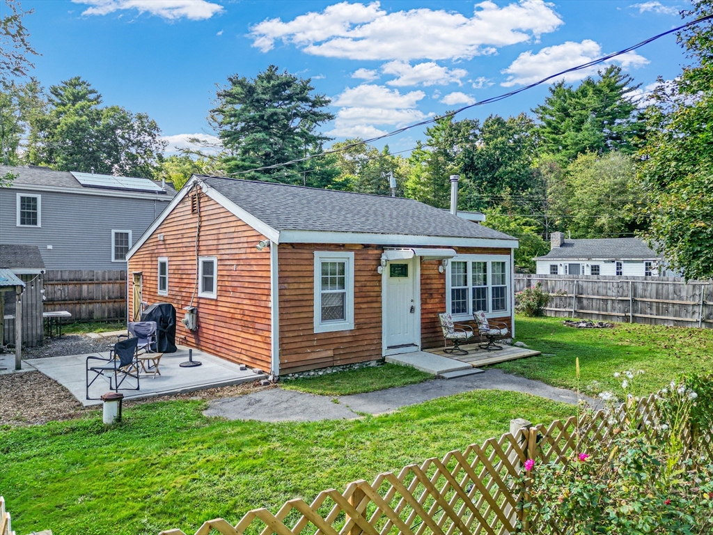 15 Morrison Way Lakeville, MA 02347 - Photo 2 of 26 a view of a chair and table in backyard of the house